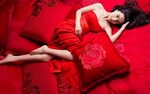 Woman wearing red strapless dress lying on bed HD wallpaper 